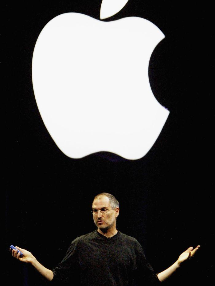 Steve Jobs Apple Logo - Steve Jobs under Apple logo - ABC News (Australian Broadcasting ...