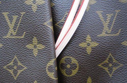 Close Up of Louis Vuitton Logo - Louis Vuitton. Designer Handbag Bible