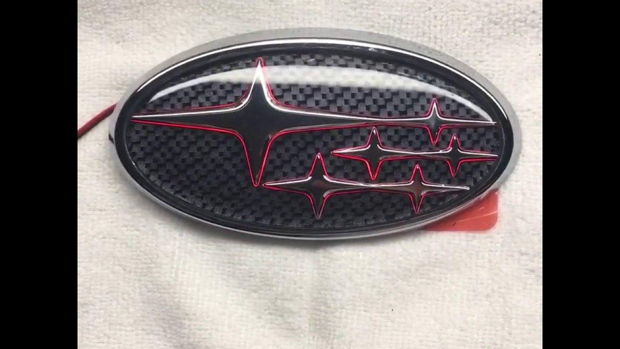 Red Subaru Logo - Carbonfiber background with red LED rear Subaru emblem
