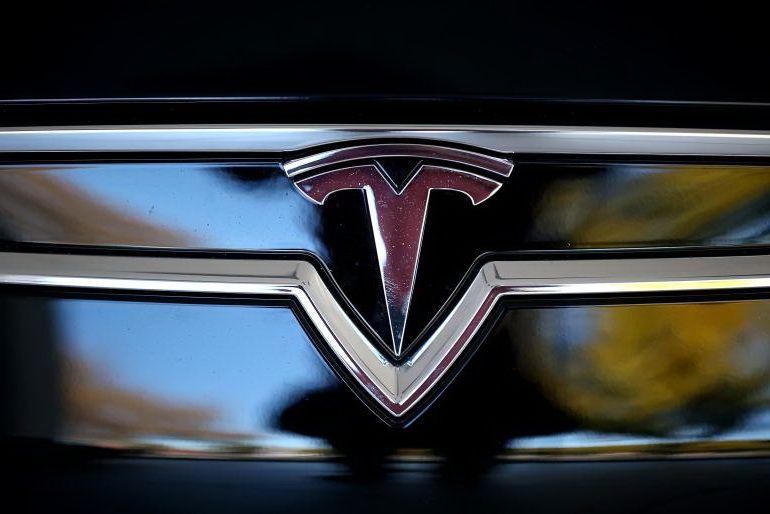 Car with T in Shield Logo - Tesla Logo, Tesla Car Symbol Meaning and History. Car Brand Names.com
