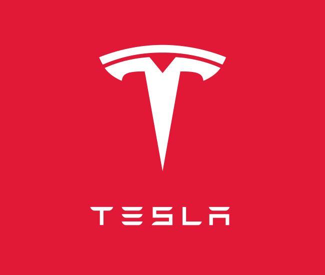 Car with T in Shield Logo - The Tesla Motors logo is a cross section of an electric motor