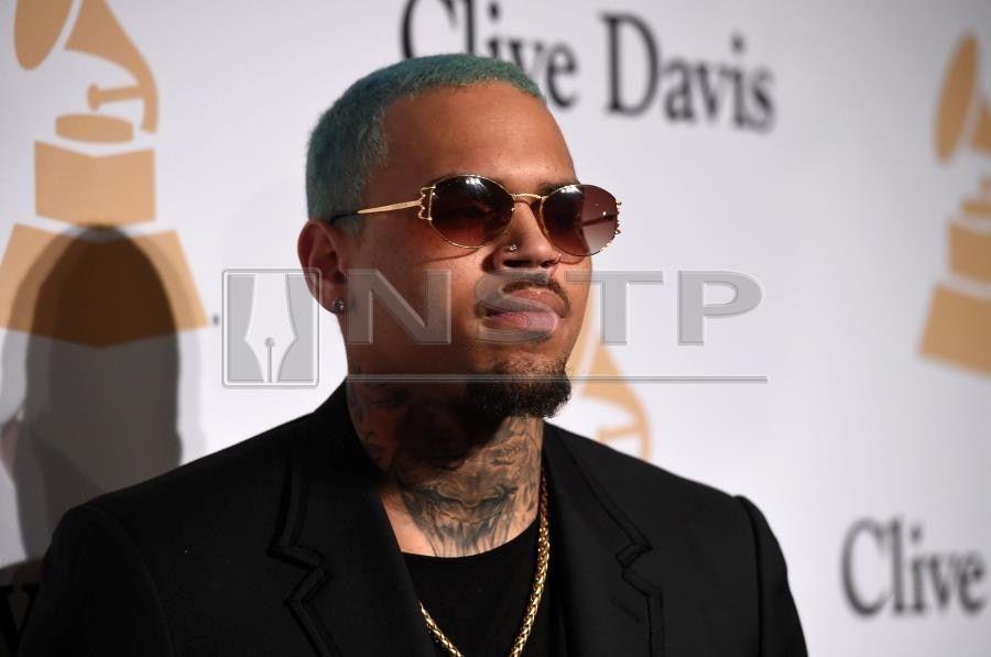 Paris Rapper Logo - Update) Rapper Chris Brown detained in Paris after rape claim