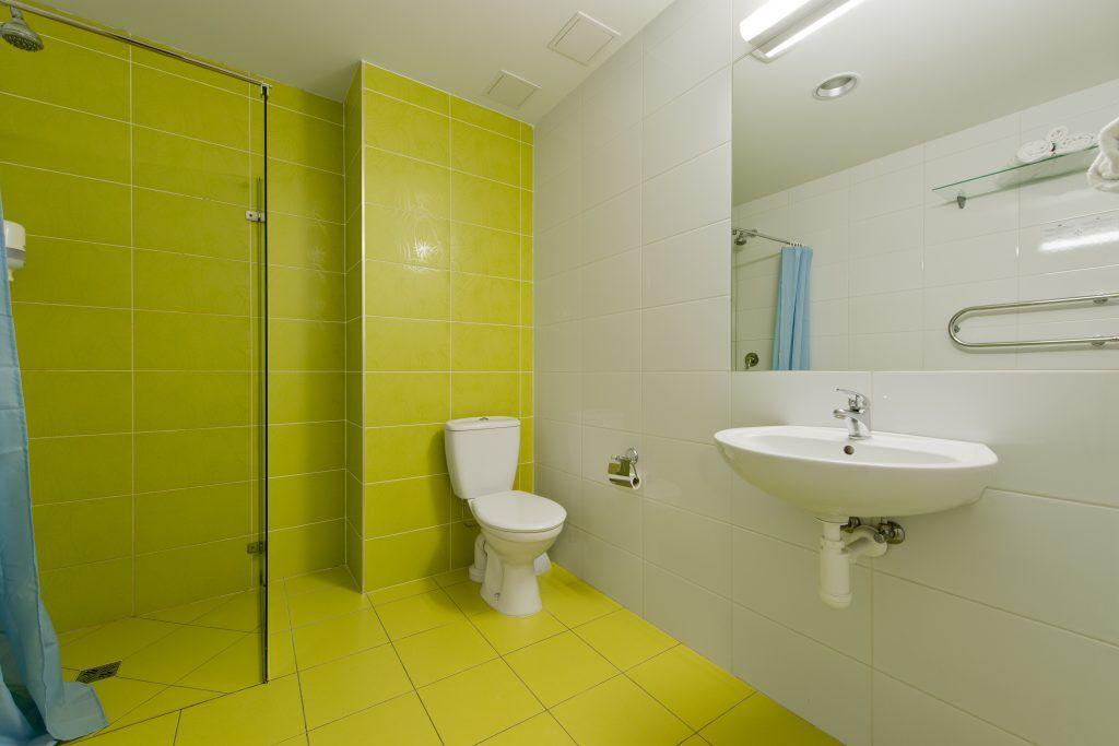 Yellow and Green Hotel Logo - Green Vilnius Hotel - ten-storey, 126-room economy class hotel