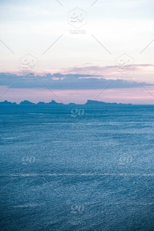Pink Water with Mountains Logo - Romantic sunset view over sea water and mountains of island in