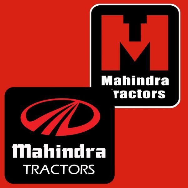 Image of Mahindra tractor logo with black clay/mud after cultivating  agriculture fields.-YJ143591-Picxy