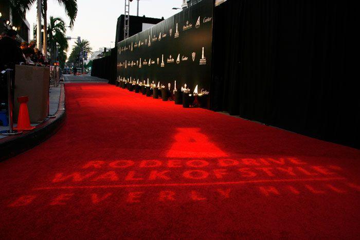 Cartier Red Logo - A gobo on the red carpet showed the evening's logo, and a black