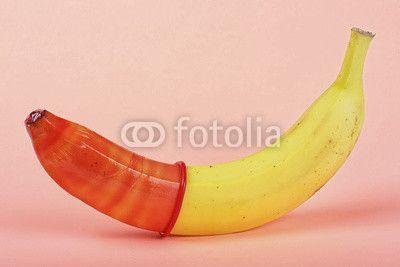 Red and Yellow Banana Logo - Yellow banana with red condom on a pink background. Buy Photo. AP