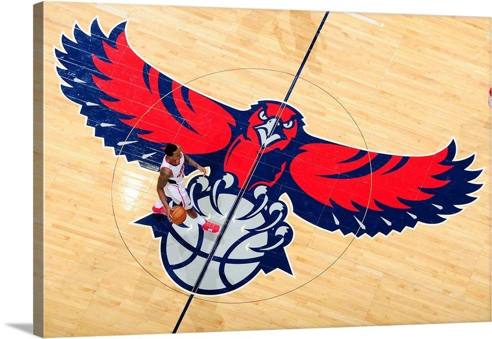 Ball Hawk Logo - Jeff Teague 0 of the Atlanta Hawks takes the ball up court across ...