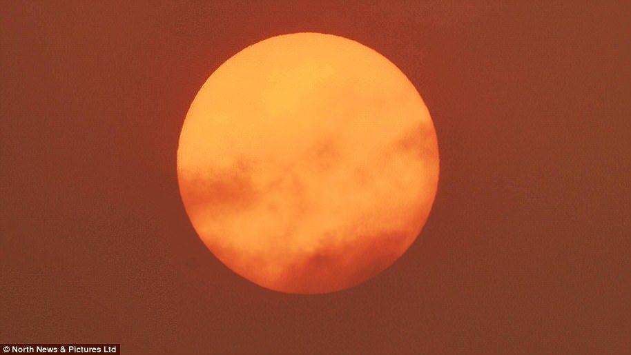 Red and Orange Sun Logo - Hurricane Ophelia creates red sun in skies over England. Daily Mail