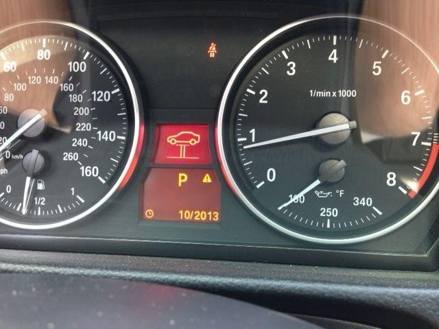 BMW Red Car Logo - Red car on a lift warning light - 3 possible causes