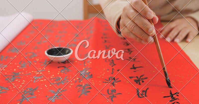 Asian Red Writing Logo - Asian Man Writing Chinese Calligraphy on Red Paper - Photos by Canva