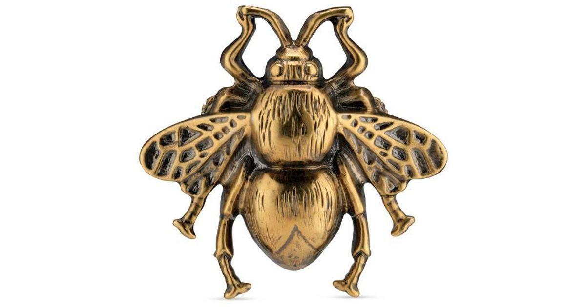 gucci bug logo