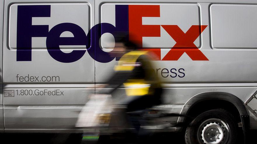 Holiday FedEx Logo - FedEx, UPS fight to keep up with holiday demand