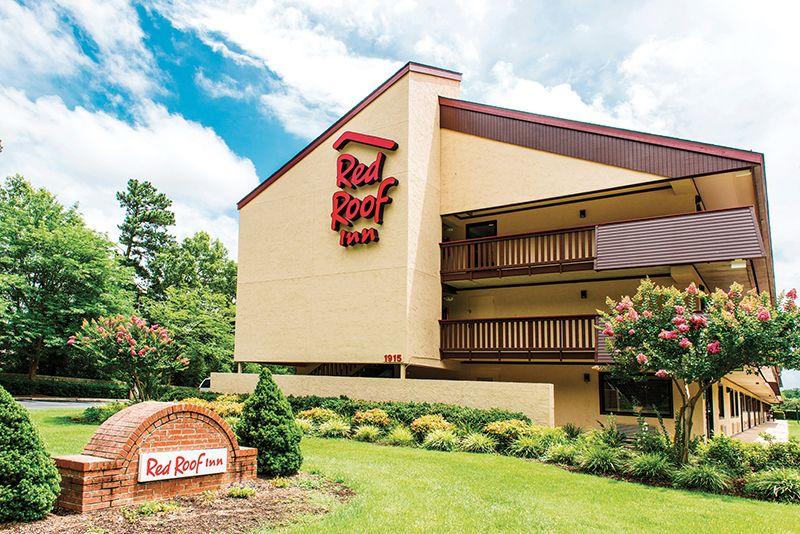 Small Red Roof Inn Logo - Red Roof Inn brings upscale economy from small town to global stage