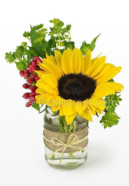 Green Petal Flower Company Red Logo - Sunflower arranged in mason jar with red berry accents and soft