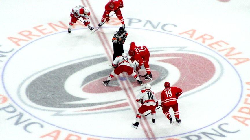 Red White and Triangle Sports Logo - Hurricanes Fans See Structured Play In Red White Scrimmage