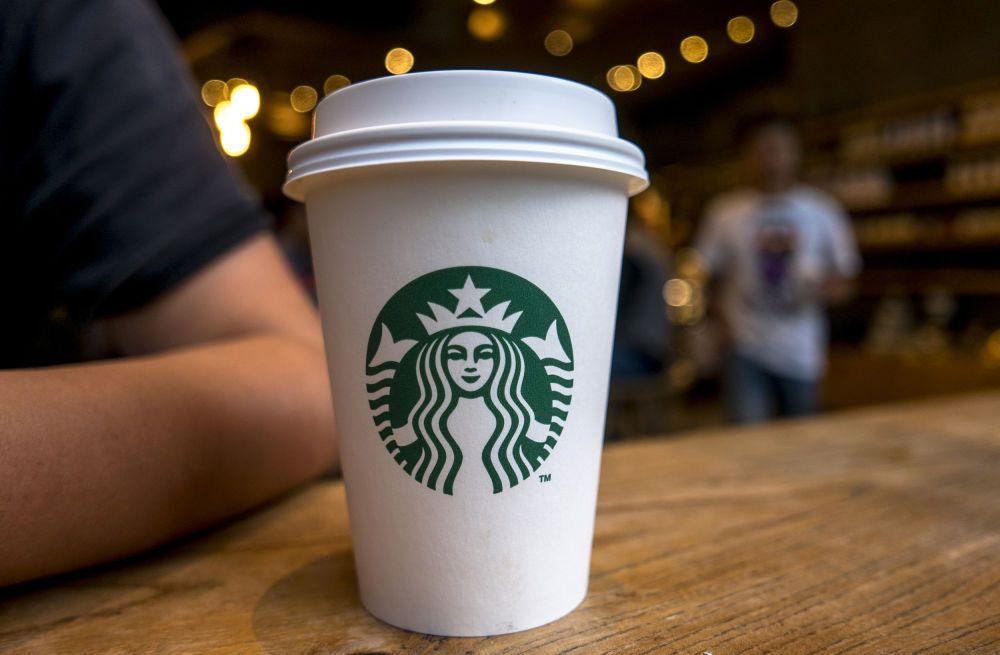 Medium Starbucks Logo - Why siren in Starbucks logo was deliberately made asymmetrical - AOL ...