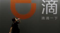 Hu Xing Didi Logo - As China's Didi looks abroad, challenges spring up at home