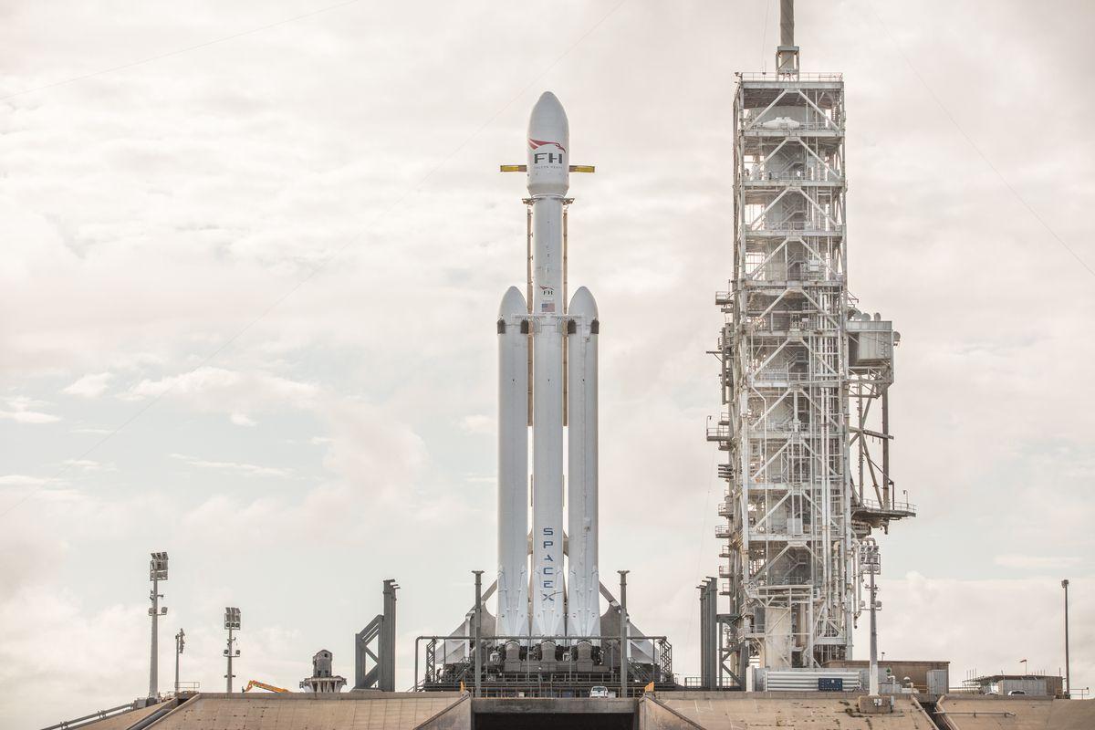 Verical SpaceX Falcon Heavy Logo - SpaceX shows off stunning pictures of its Falcon Heavy rocket fully ...