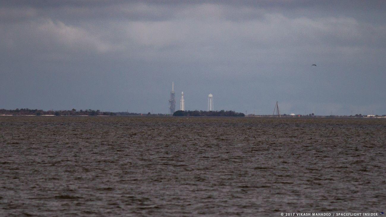 Verical SpaceX Falcon Heavy Logo - SpaceX Falcon Heavy raised for 1st time at Kennedy Space Center