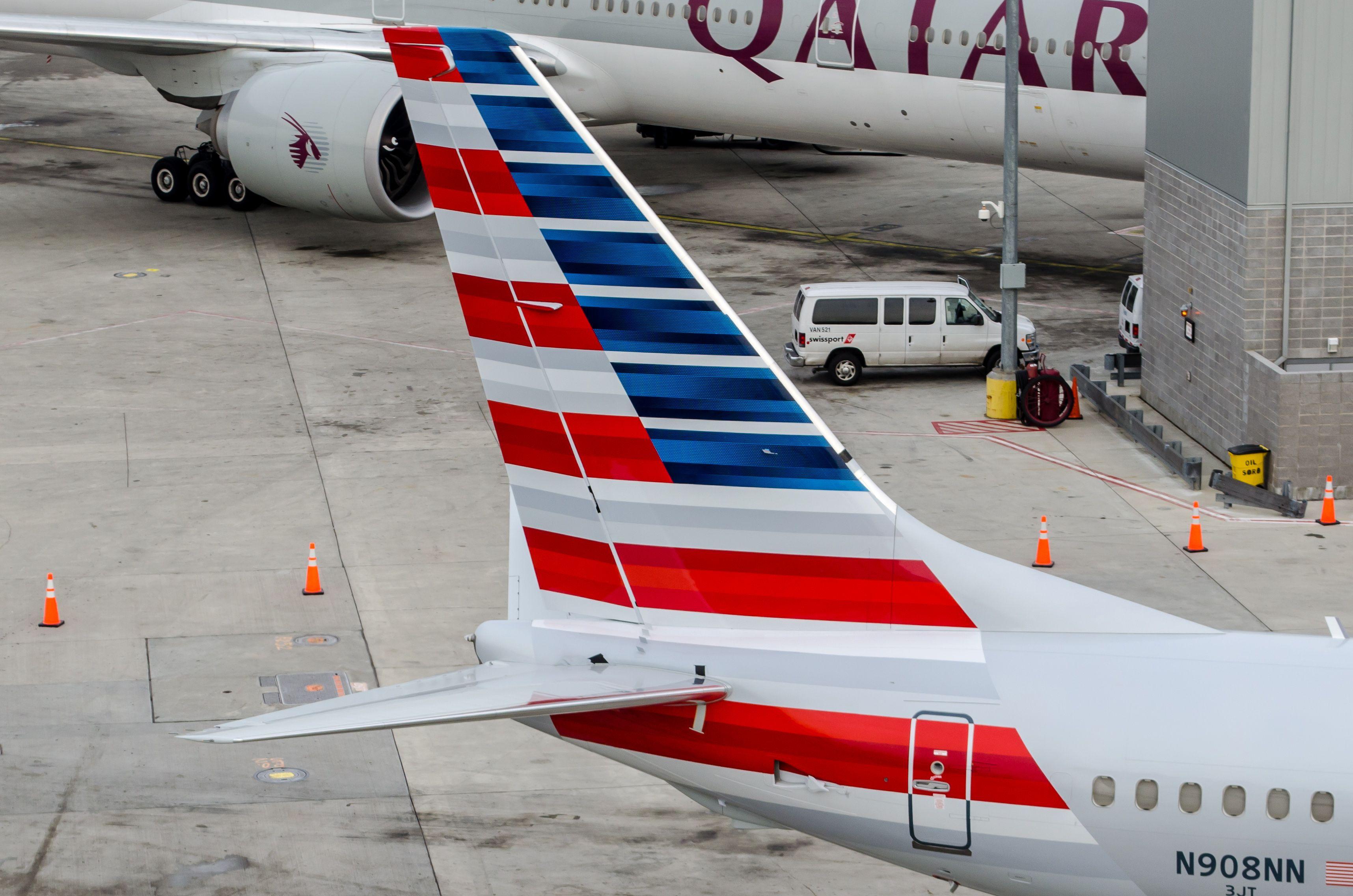 Airline with Red Swoosh Logo - Colgan Air and American Airlines Tail Logos