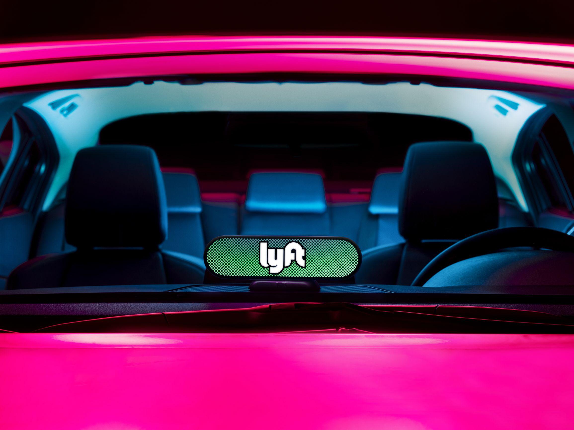 Pink Mustache Logo - Lyft Introduces Amp: Dashboard Light for Drivers | Time