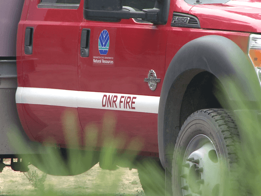 WA DNR Logo - acre fire threatens buildings near Tonasket