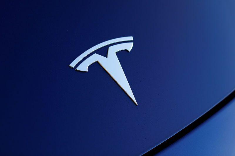 Blue Tesla Logo - Tesla shares rise as Musk says Model 3 set to hit target