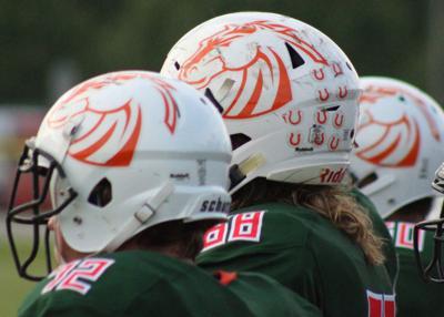 Mustang Football Helmet Logo - Mustangs unveil new look | Denver Citizen | lakenormanpublications.com