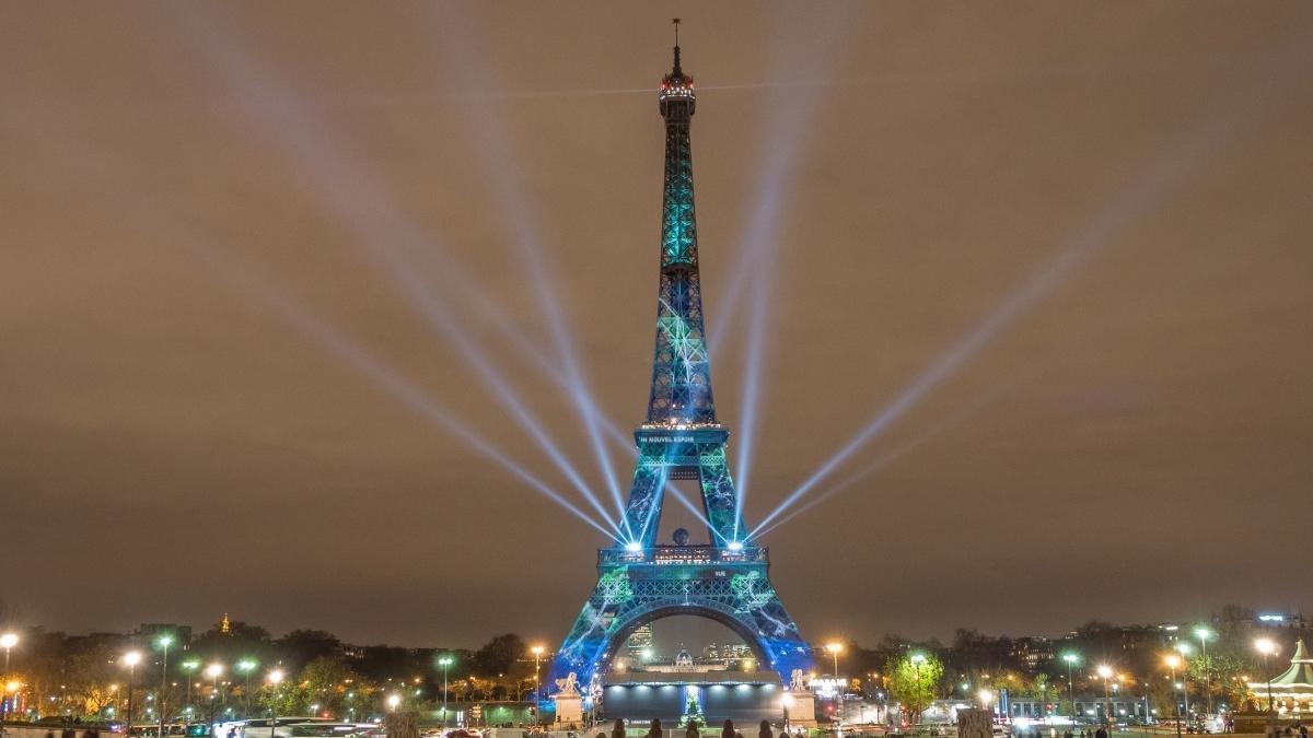 Ifal Tower with Red and Blue Circle Logo - Eiffel Tower at night, Illuminations & light show