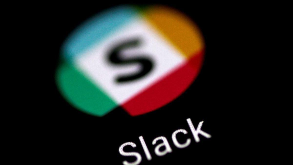 White and Red ADP Logo - Slack benefits from SoftBank's $100 billion fund - The National