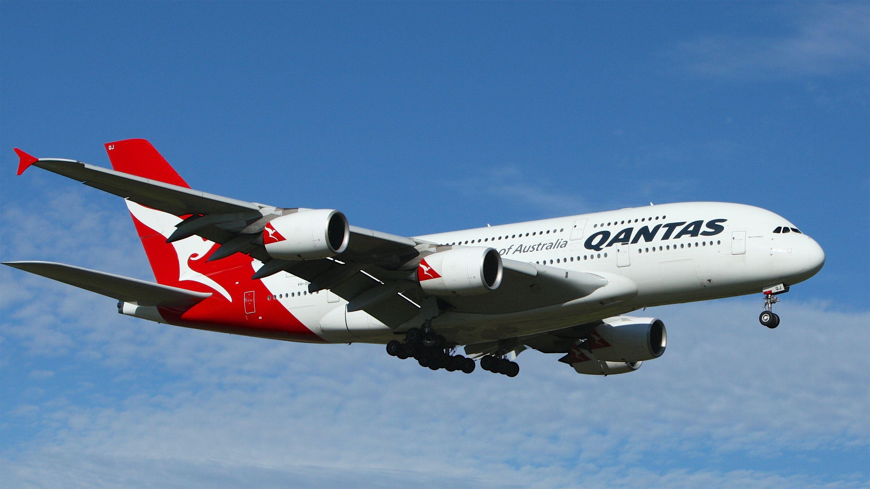 White and Red Airline Logo - White and Red Qantas Airplane Fly High Under Blue and White Clouds ...