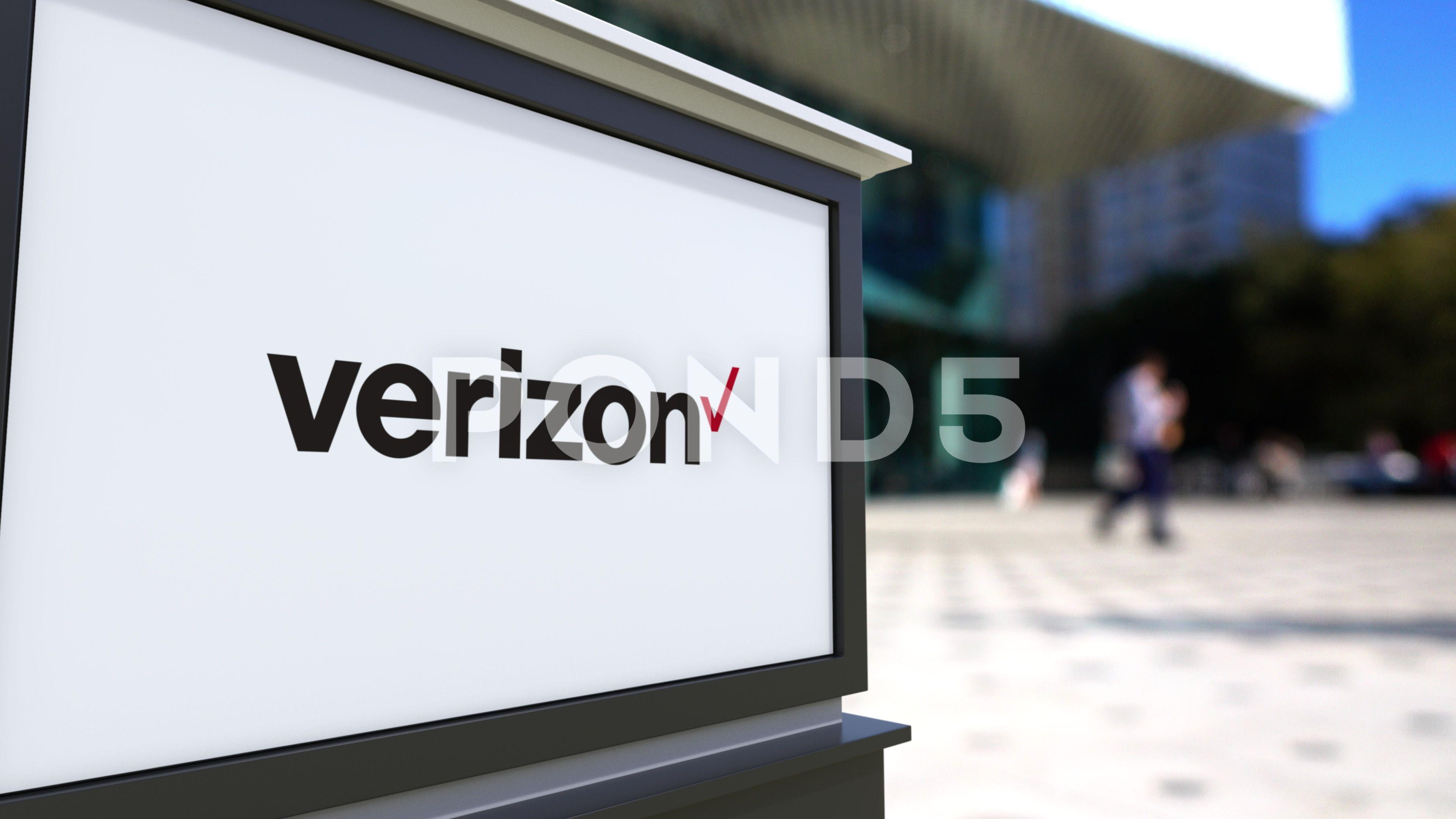 Verizon Communications Logo - Street signage board with Verizon Communications logo. Blurred