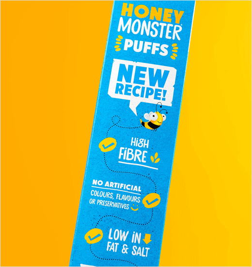 Robot with Yellow Food Logo - Robot Food Gives Honey Monster Puffs a New Look