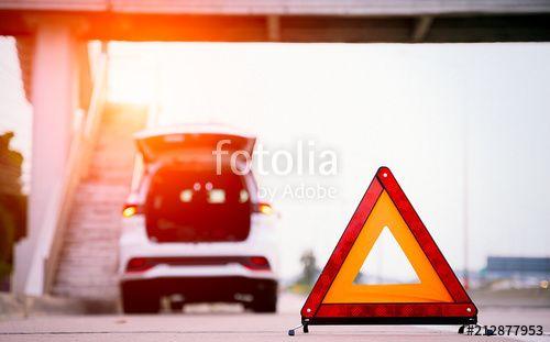 Red Triangle Car Logo - Red triangle warning sign on the road, car with breakdown alongside
