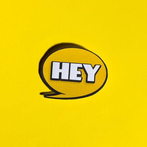 Yellow Bubble Logo - Hey speech bubble on yellow backdrop Photo