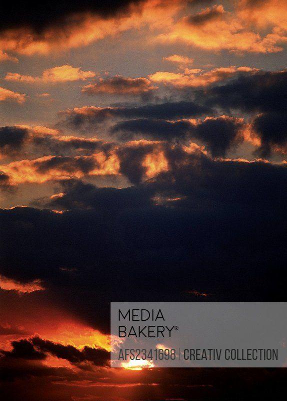 Dark Red Cloud Logo - Mediabakery - Photo by Age Fotostock - sunset behind dark red clouds