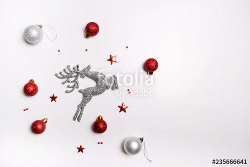 Red and Silver Ball Logo - Christmas composition. Red and silver balls, deer and tinsel on a