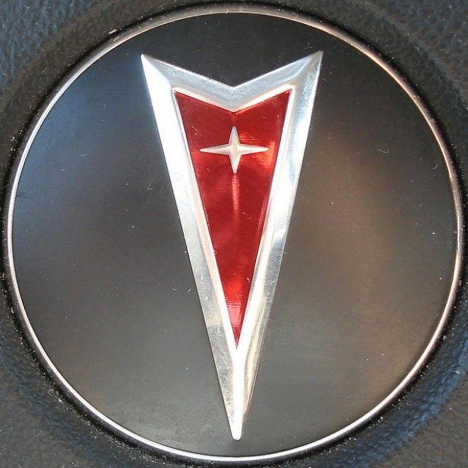 Car with Red Triangle Logo - Red Triangle Car Logo
