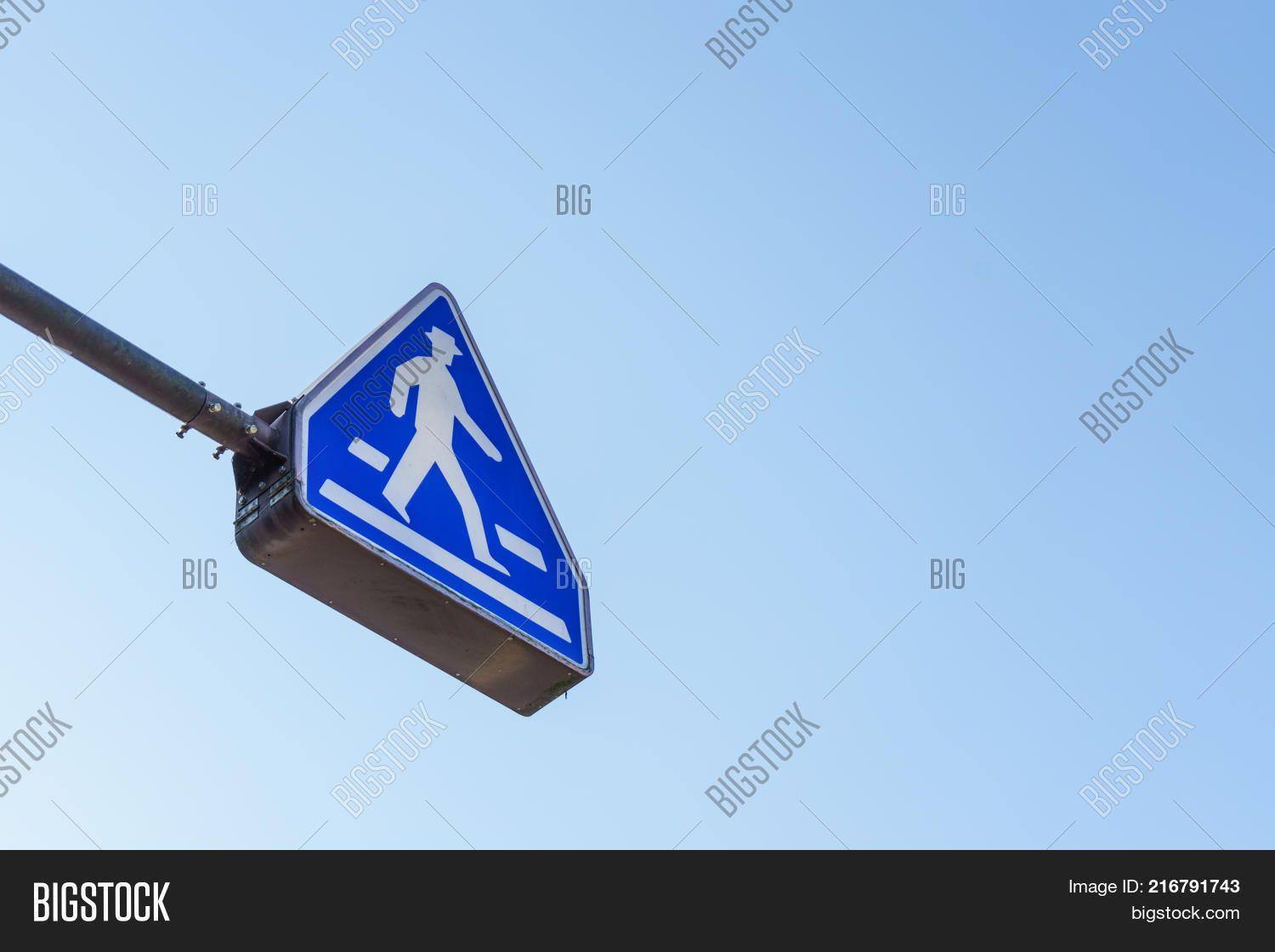 Red Triangle White Triangle above Logo - PowerPoint Template: blue triangle crosswalk sign above street the ...