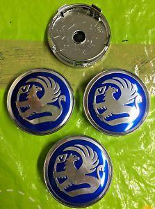 Circle in Silver with Blue Center Logo - Vauxhall Wheel Centre Cap 60mm Blue Silver Set Of 4 Hub Caps Emblem