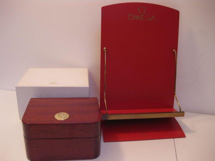 Red Omega Logo - Omega set: Glossy wooden box with metal diadem with Omega logo ...