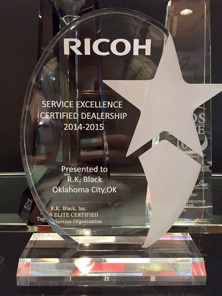 Ricoh Service Excellence Logo - Copier & Printer Solutions for Businesses in Oklahoma & Kansas. RK