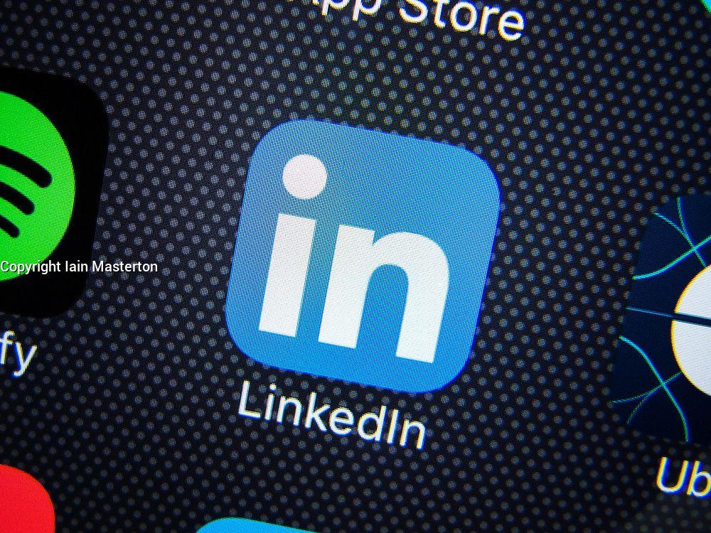 LinkedIn App Logo - LinkedIn professional social networking app logo on screen of iPhone ...