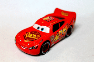 Disney Pixar Cars 2 Logo - Disney Pixar Cars 2 Lightning McQueen with Rust eze Logo on Tail fin