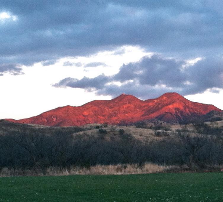 Red Mountain Red Circle Logo - Red Mountain at Circle Z Ranch | DudeRanch.com