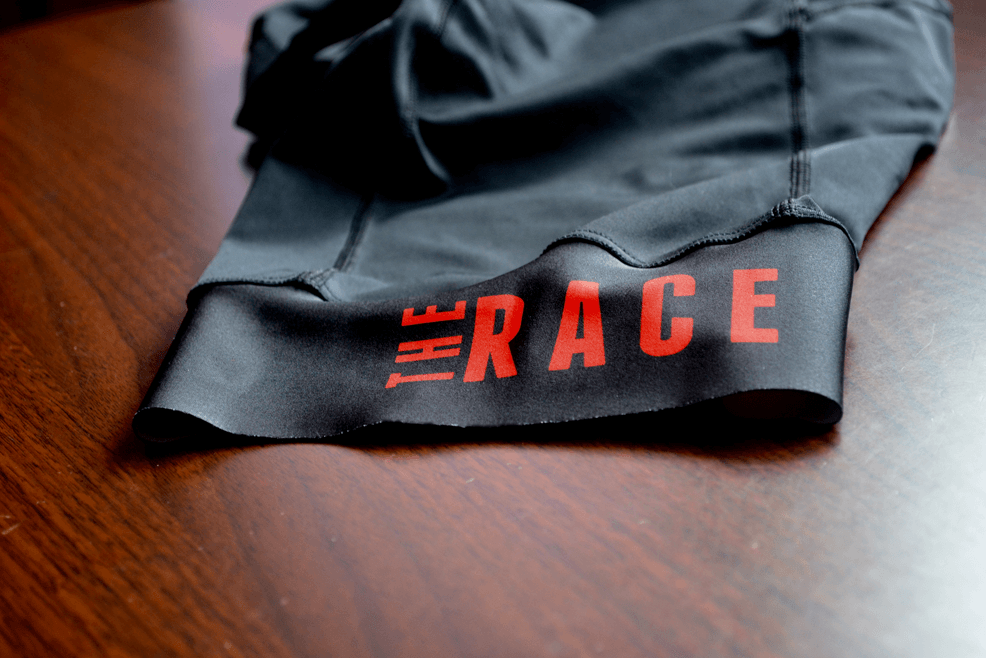 Red White Race Logo - RedWhite - The Race bib shorts review - LA VELOCITA.