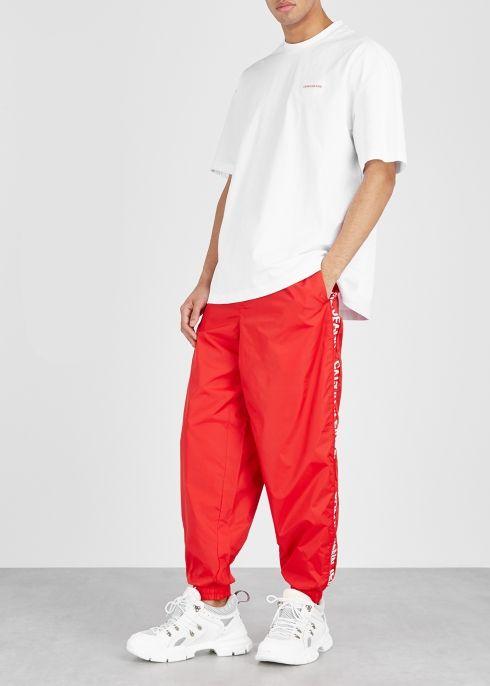 Red Person Logo - Calvin Klein Jeans Red Logo Print Nylon Sweatpants