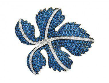 Round White with Blue Lines Logo - The stylised maple leaf pavé-set with sapphires and accented by ...