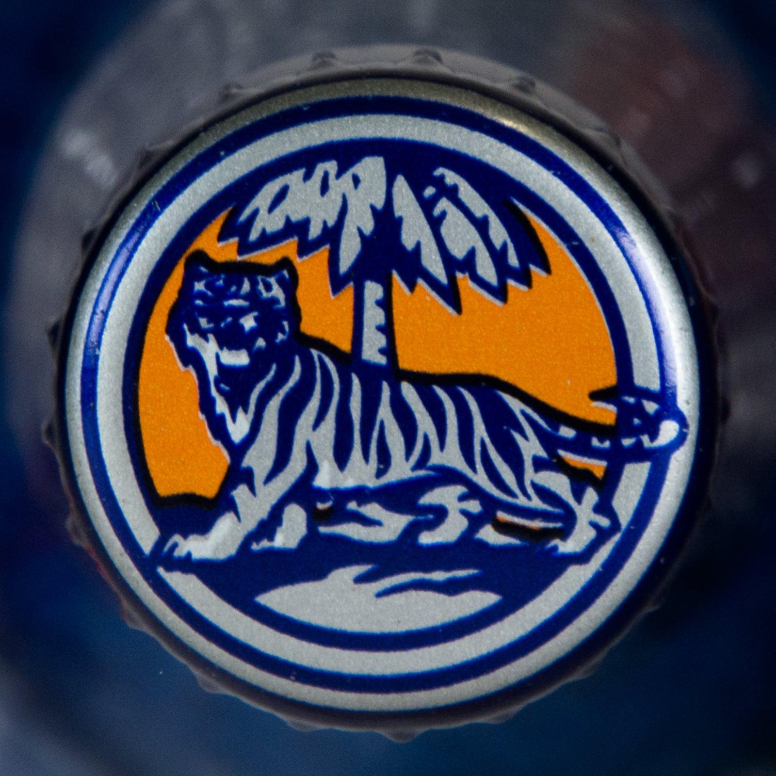 Blue and Orange Tiger Logo - Tiger Beer Bottle In Blue Wrap With Large Logo And Orange Text - APB ...
